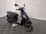 a scooter that is parked in a room