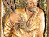 a statue of a man holding a guitar in his hand