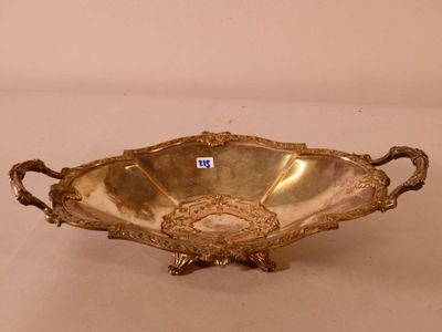 an antique silver plate with handles and handles on a white surface