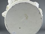 an image of a white vase sitting on top of a table
