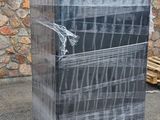 a stack of boxes wrapped in plastic sitting on a pallet
