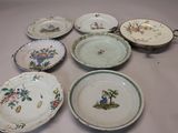 many plates that are sitting on a table
