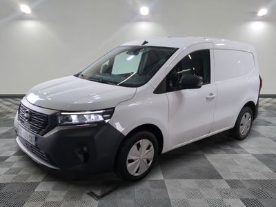 the white van is parked on a checkered floor in a room