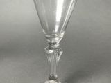 a wine glass that is sitting on a table