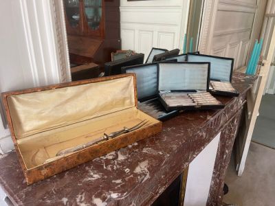 two open suitcases sitting on a table in a room