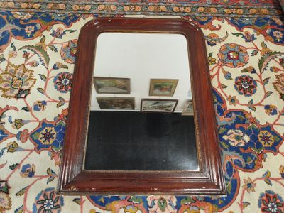 a mirror on the floor with a picture on it