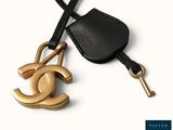 chanel bag charm in black leather with gold hardware