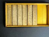 a small box of books on a black surface