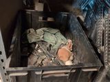 a metal box with a bunch of items inside of it