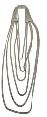 silver chain necklace on white background with clippings for clasp
