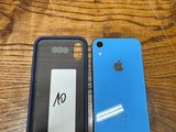 two iphones sitting side by side on a wooden table