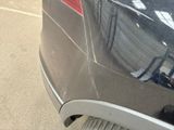 a close up of a car ' s rear end with a sticker on it