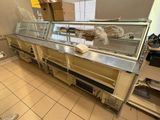 an image of a commercial kitchen with a long counter