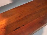 a close up of a wooden table with a white background