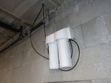 a water heater attached to the wall of a building
