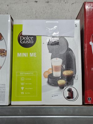 three boxes of coffee are sitting on a shelf in a store