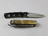 two different types of knives on a white surface