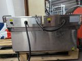 a machine that is sitting on a pallet in a warehouse