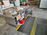an image of a work area with a lot of work on it