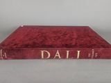 a red book sitting on top of a white table