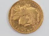 an image of a gold coin with a picture of a woman riding a horse