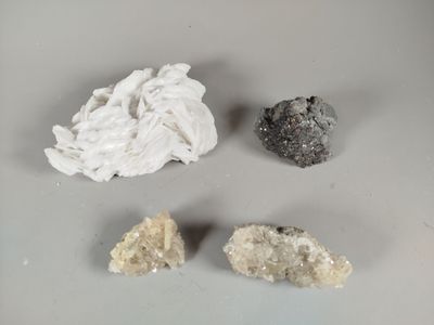 three different types of rocks are shown on a white surface