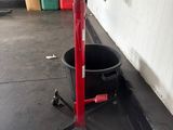an image of a bucket on a stand in a garage