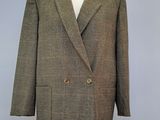 the jacket is brown and black checkered with gold buttons