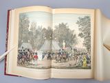 an open book with a picture of a military scene on it