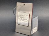 a silver lighter sitting on top of a glass holder