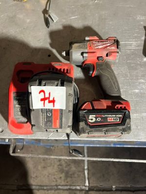 two power tools that are sitting on a table
