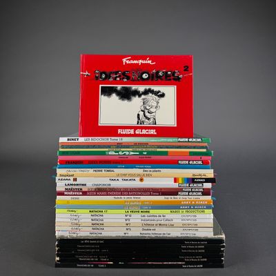 books stacked on top of each other on a gray surface