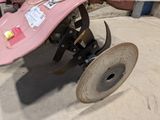 a pink skateboard sitting on top of a pink plow