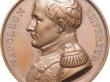 an image of a bronze medal of a man in uniform