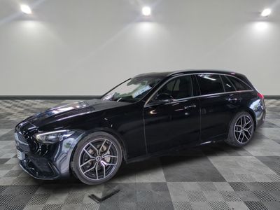 a black mercedes gle parked in a garage with a checkered floor