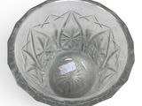 a clear glass bowl with a star design on it