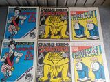 quatre bandes dessinées sont posées par terre devant un radiateur, un radiateur, un radiateur, un radiateur, un radiateur, un radiateur, un radiateur