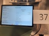 a laptop computer sitting on top of a counter