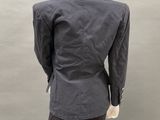 an image of a mannequin wearing a suit and tie
