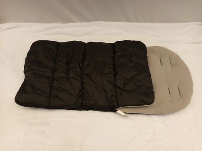 a sleeping bag on a bed with a pillow on it