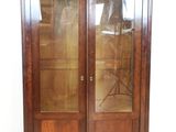 an image of a wooden cabinet with glass doors