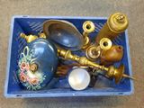 a blue container filled with antique items on the floor
