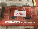 a picture of a red battery charger with a price tag on it