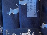 a close up of a neck tie with a horse and carriage on it