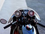 a close up view of a motorcycle ' s headlight and gauges