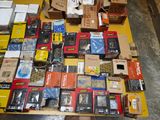 many boxes of electronic equipment on a table