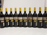 several bottles of wine are lined up on a table