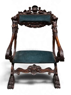 an old wooden chair with a green upholstered seat
