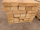 several pieces of wood stacked on top of each other in a pile