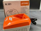an orange and white electric blower sitting on top of a table